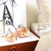 Jewelry organizers on bed side table